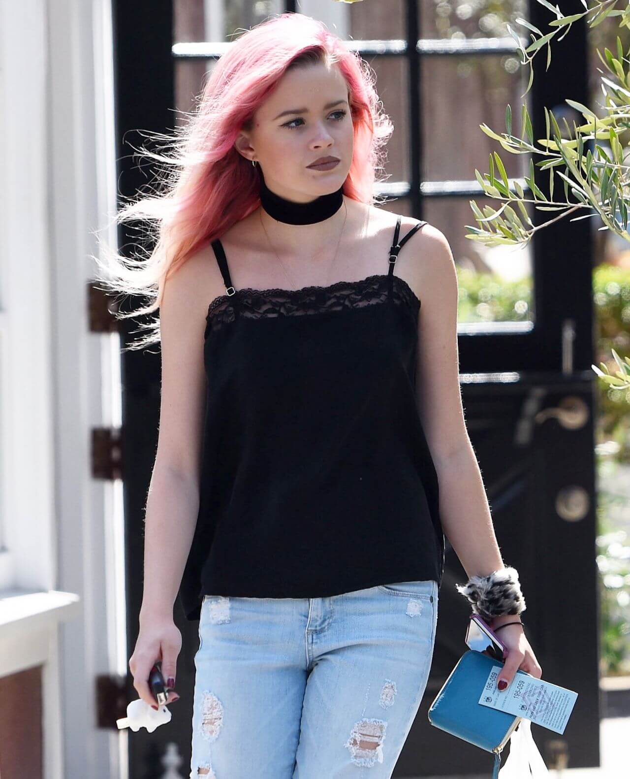 Ava Elizabeth Phillippe In Black Strap Sleeves Top With Blue Ripped Denim Jeans