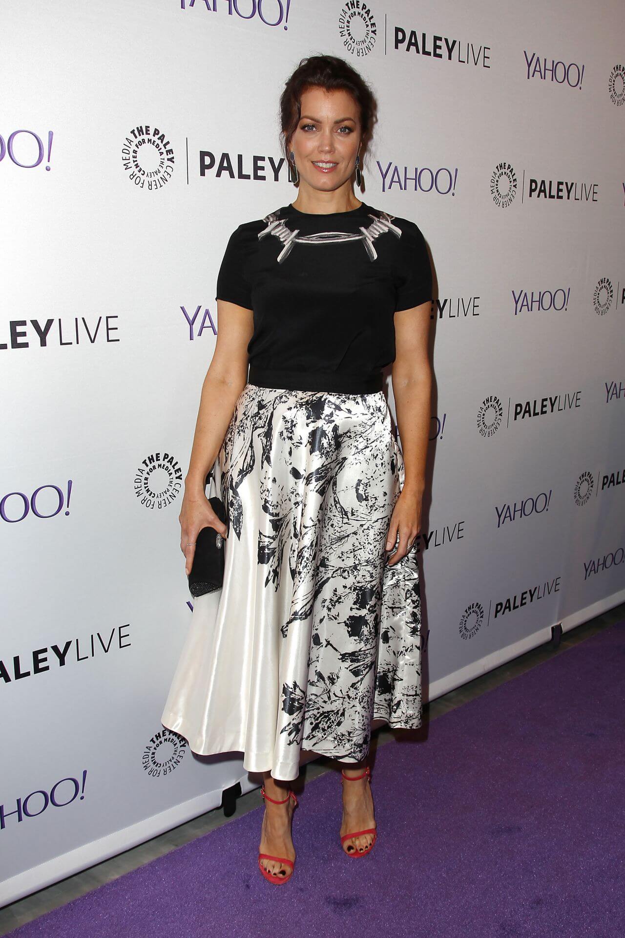 Bellamy Young  In Black Top With White Satin Fabric Printed Long Skirt