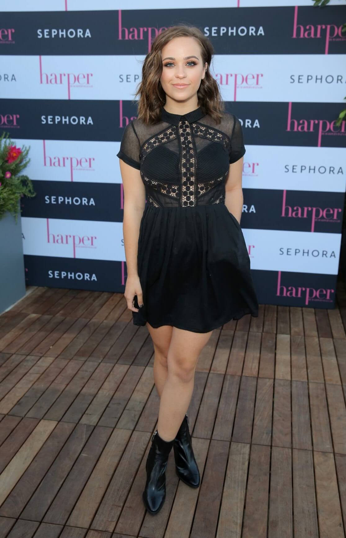 Cailee Rae In Black Half Sleeves Mini Outfit At Harper by Harper’s BAZAAR September Issue Party in Los Angeles