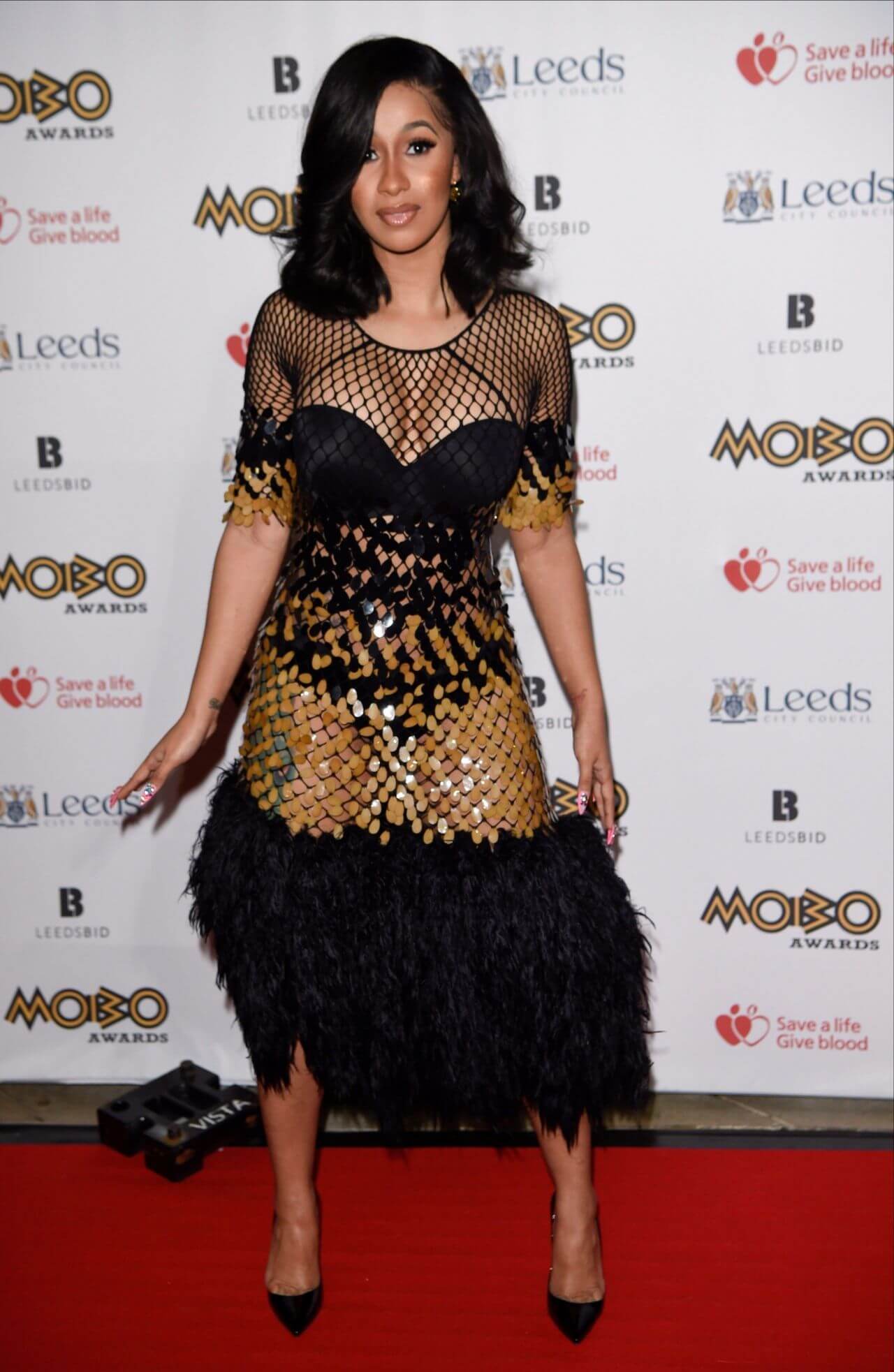 Cardi B  In Black Shimmery Crochet Pattern With Feather Style Gown Dress At MOBO Awards in Leeds