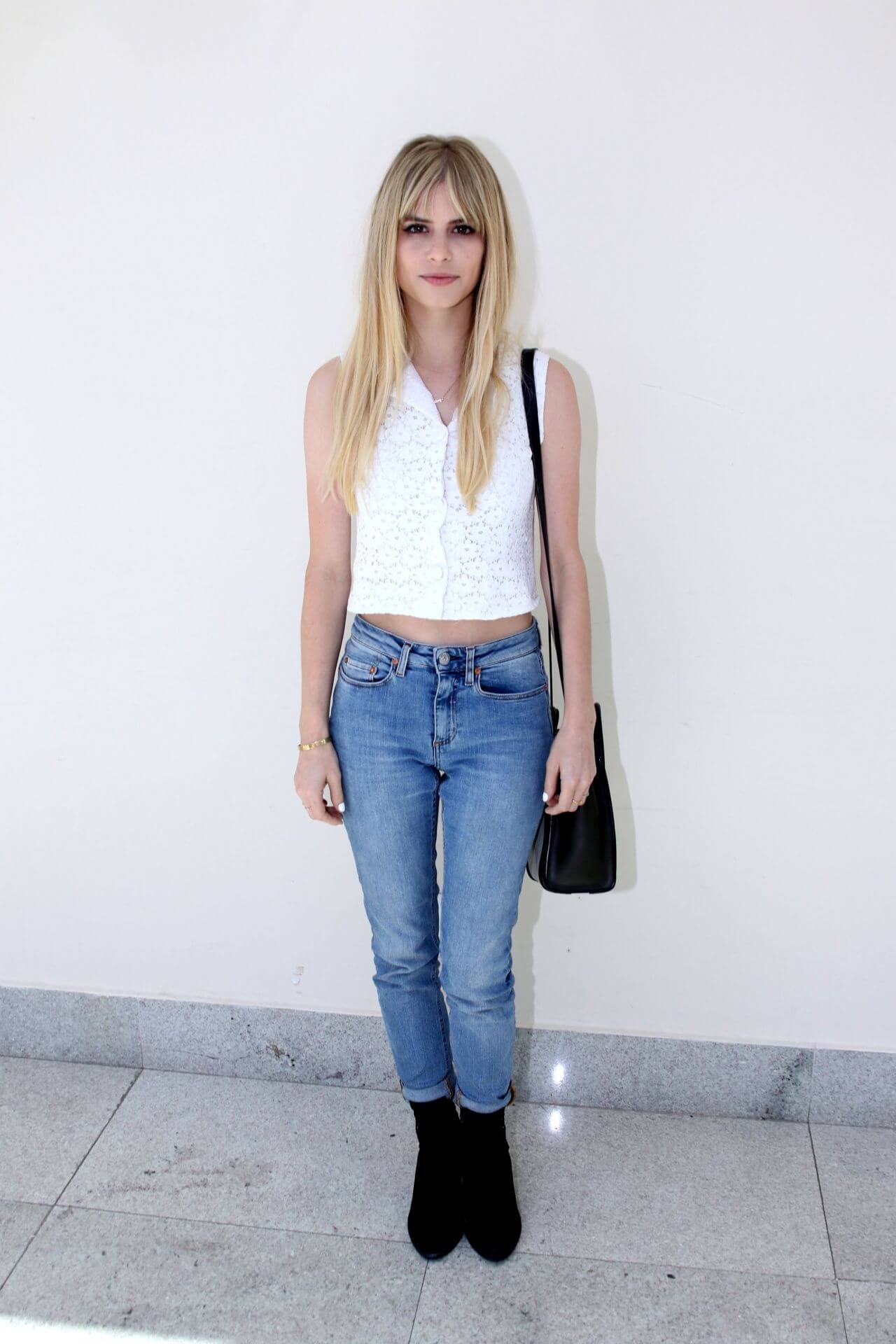 Carlson Young  In White Crop Top With Blue Denim Jeans At Bloody Weekend Convention in São Paulo with Daniel Sharman