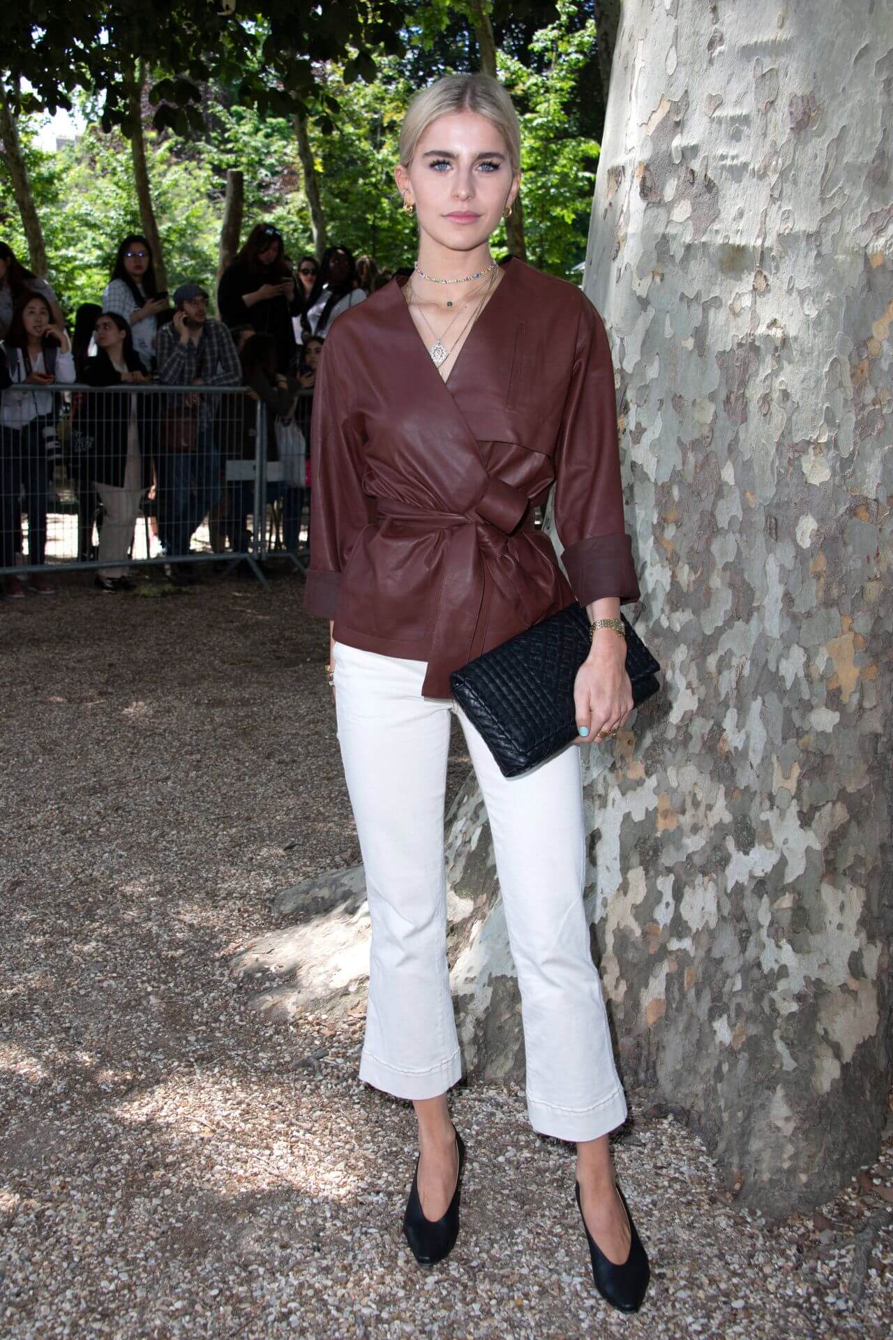 Caroline Daur In Brown Leather Full Sleeves Top With White Pants At  Berluti Menswear Spring Summer Show in Paris