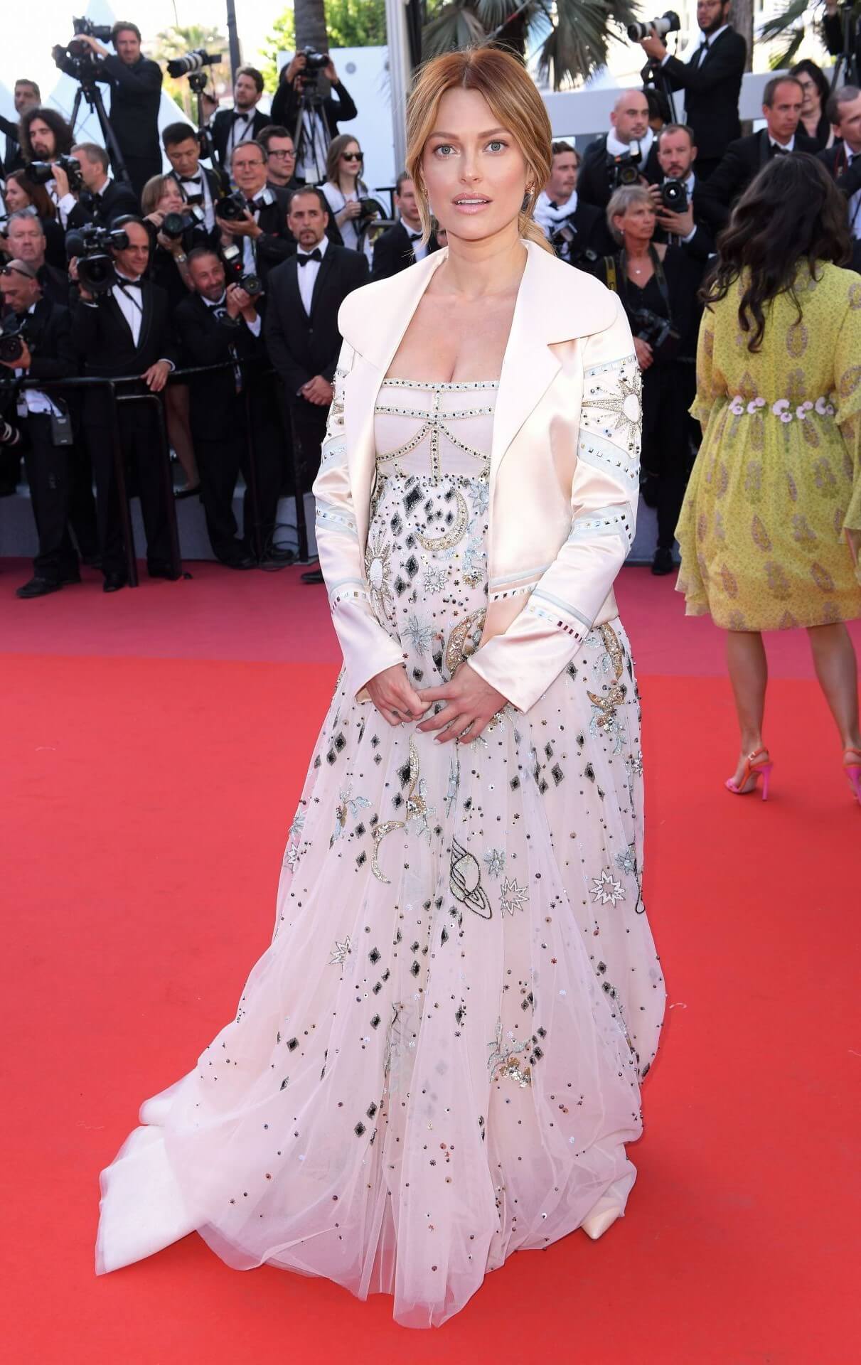 Caroline Receveur In White Shimmery Embroidery Flare Gown With Coat At “Girls of the Sun” Premiere In Cannes Film Festival