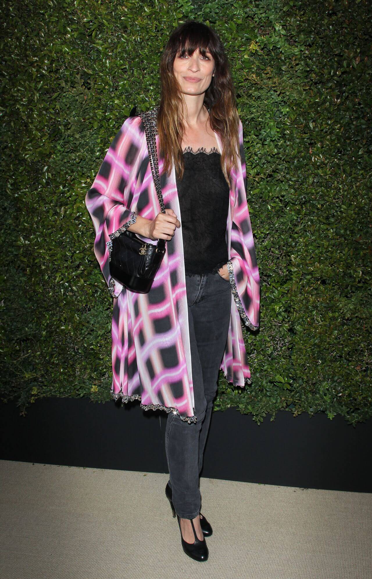 Caroline de Maigret In Pink Checked Long Shrug With Black Top & Jeans At Chanel Dinner in Los Angeles,