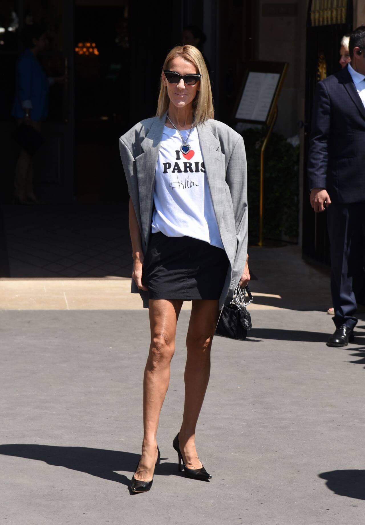 Celine Dion Fabulous Looks In White T-shirt & Black Mini Skirt With Grey Blazer Outfits