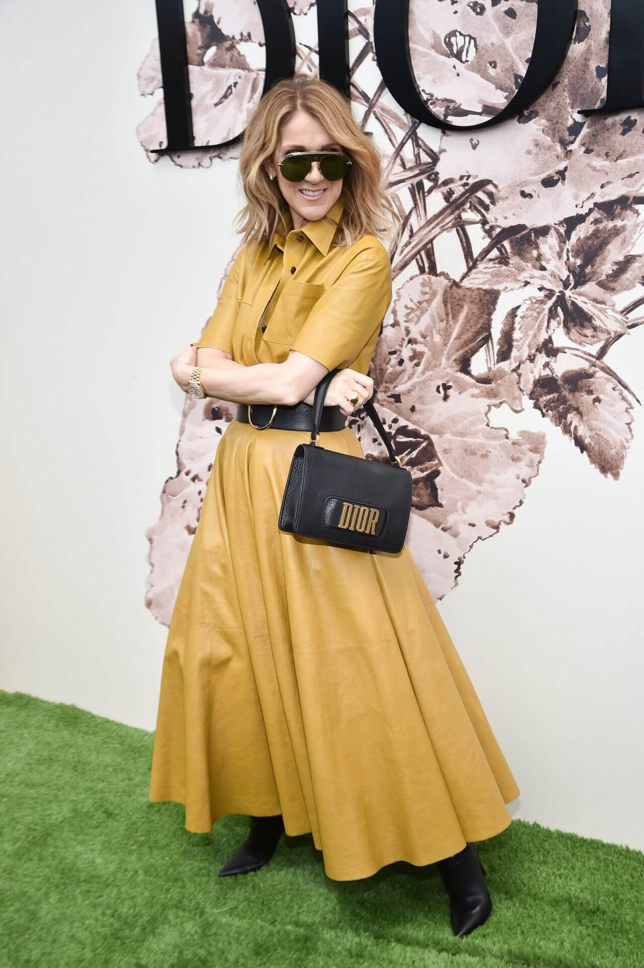 Celine Dion  In Yellow Flare Long Dress With Black Waist Belt At Christian Dior Show in Paris