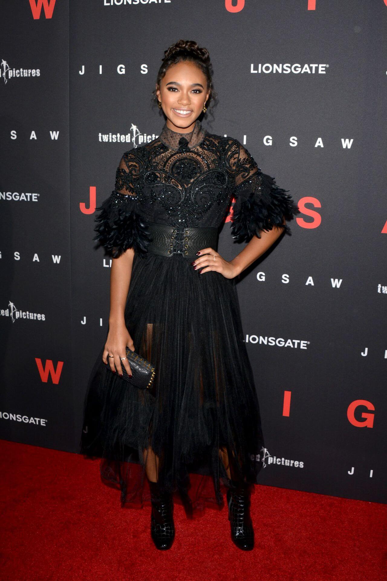 Chandler Kinney  In Black Net Fabric Shimmery Gown Dress At “Jigsaw” Red Carpet in Los Angeles