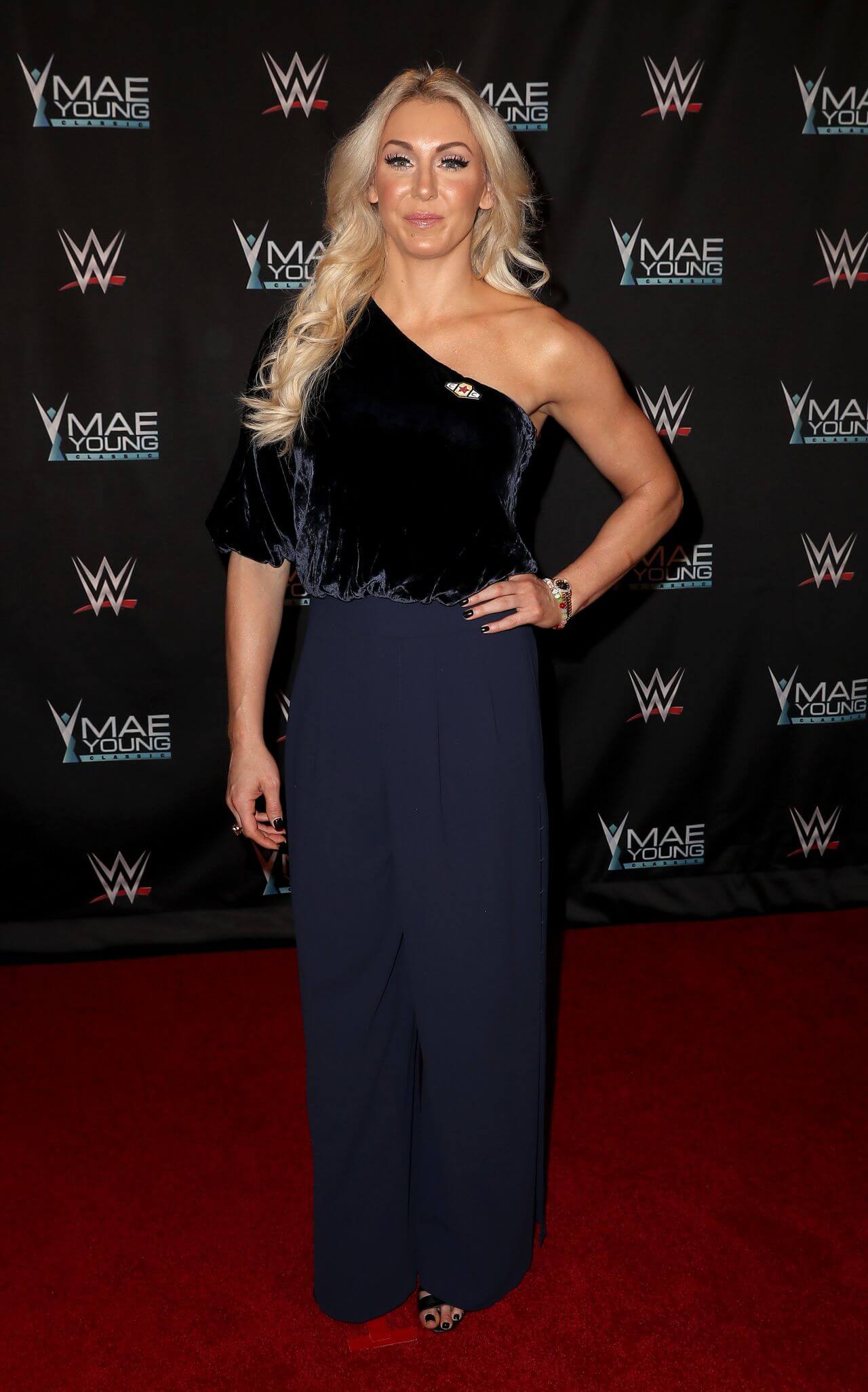 Charlotte Flair  In Blue Asymmetrical Sleeves Jumpsuit At WWE Presents “Mae Young Classic Finale” in Las Vegas