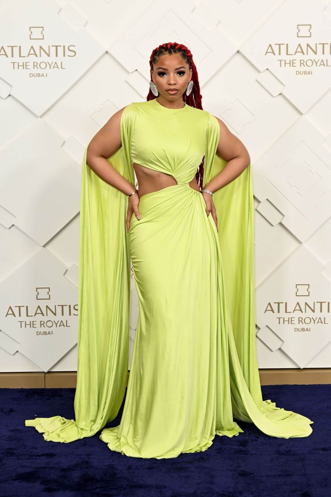 Chloe Bailey In Neon With Draping Style Cut Out Long Dress At Grand Reveal Weekend for Atlantis The Royal Dubai