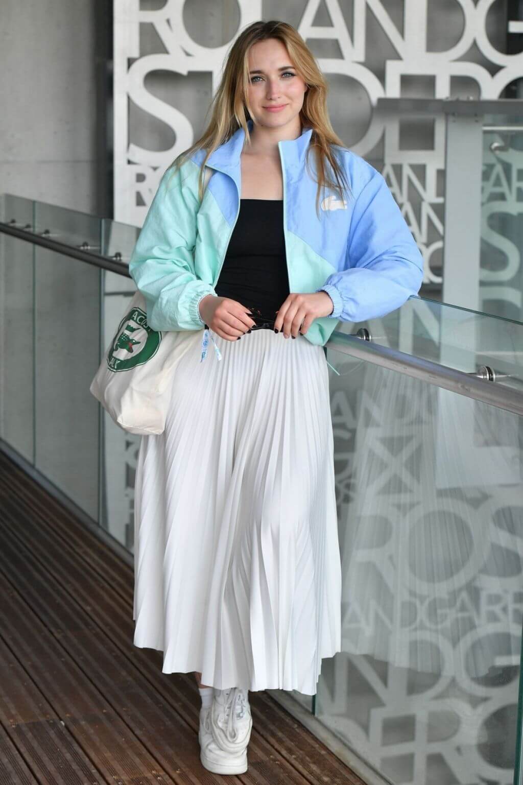 Chloé Jouannet In a Dual Shade Of Baggy Jacket Under Black Top With White Pleated Long Skirt Outfits