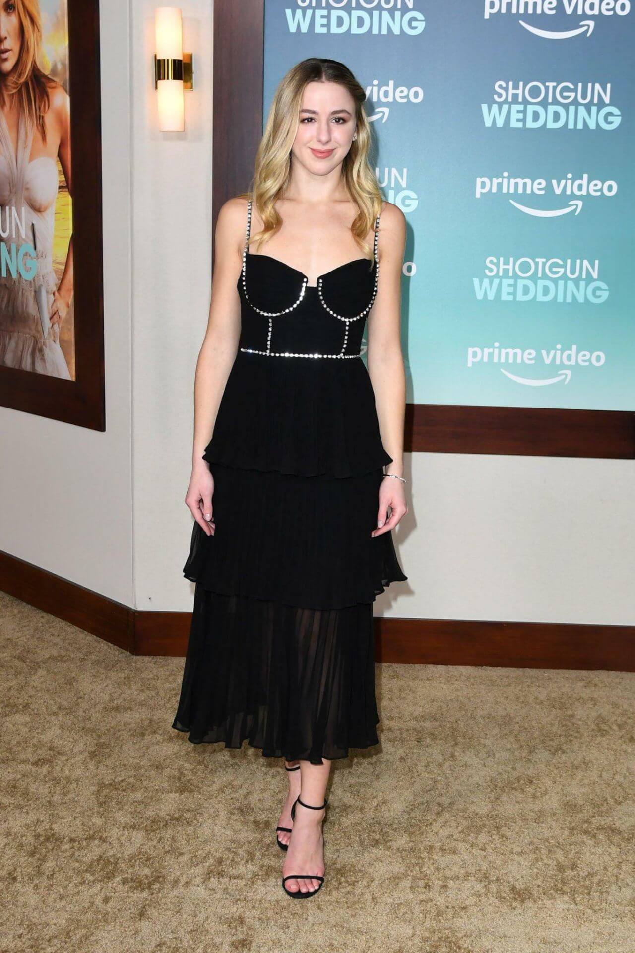 Chloe Lukasiak  In Black Strap Sleeves Long Ruffle Dress At “Shotgun Wedding” Premiere in Hollywood