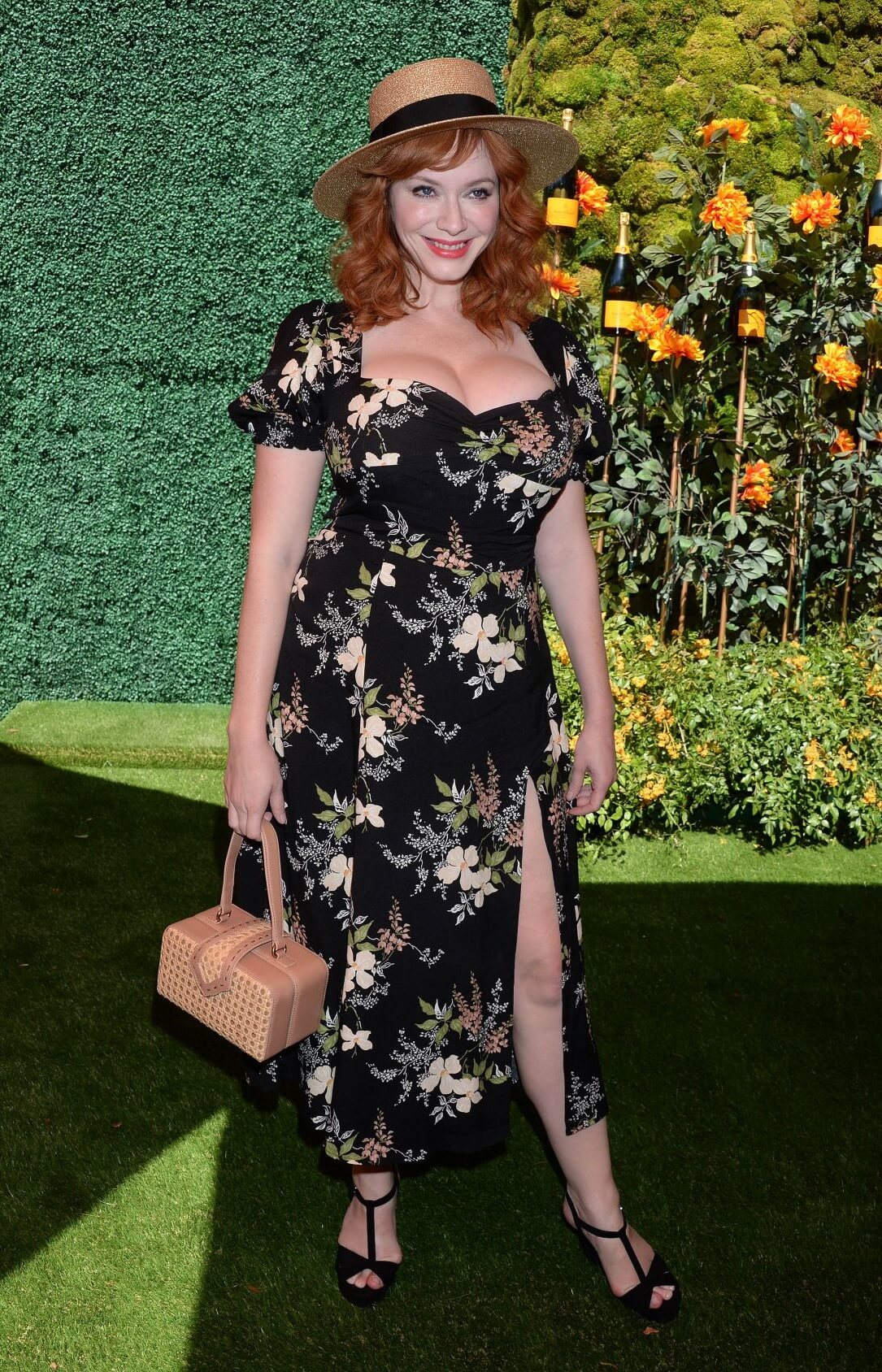 Christina Hendricks  In Black Printed Long  Slit Cut Dress With Her Hat At Veuve Clicquot Polo Classic in LA