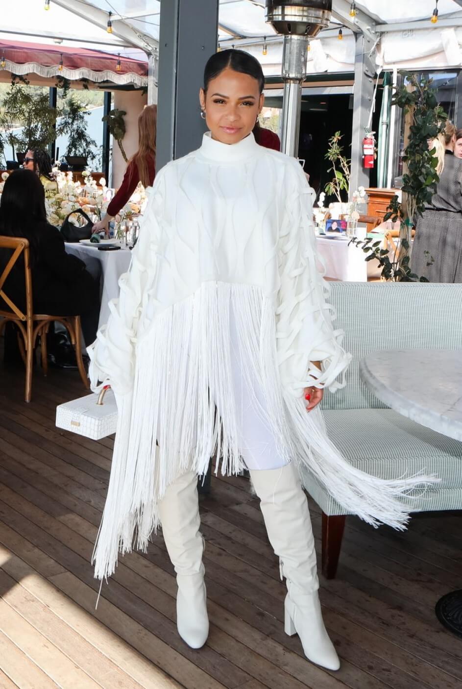 Christina Milian  In White Flappy Style Baggy Outfit At International Women’s Day Breakfast in Beverly Hills