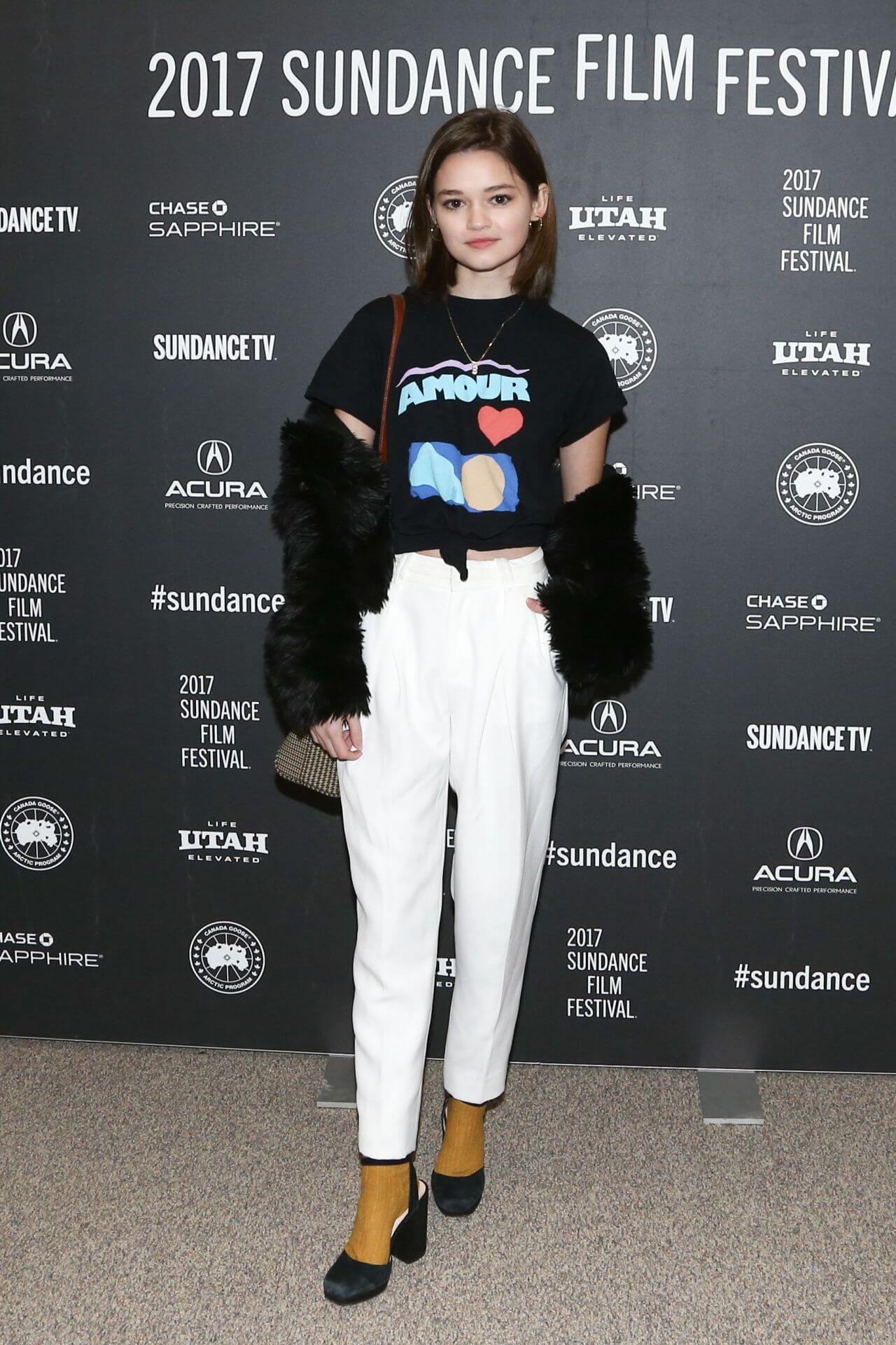 Ciara Bravo  In Black T-shirt and white Pants With Fur Coat 