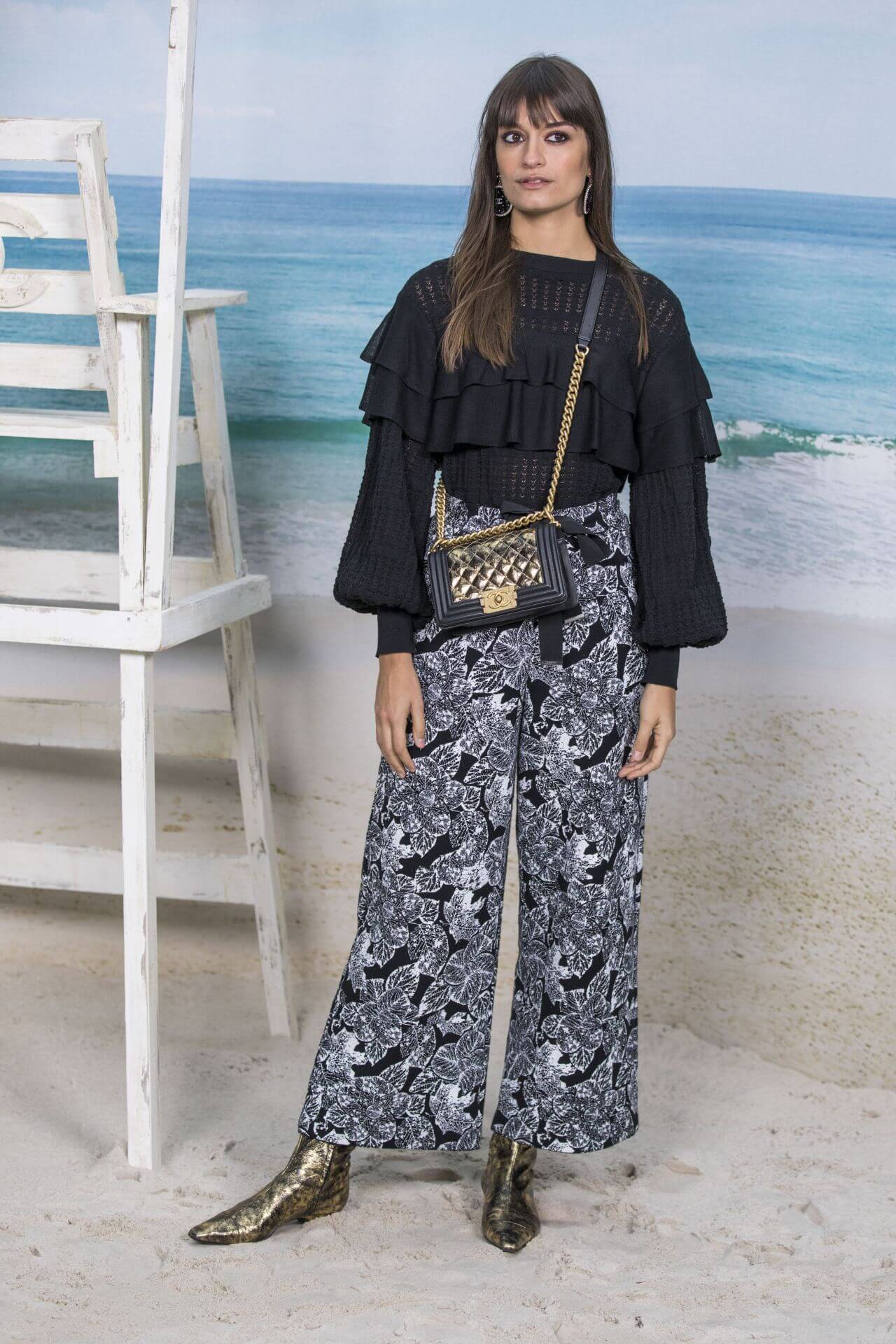 Clara Luciani In Black Baggy Sleeves Ruffle Top Printed Pants At  Chanel Collection Show In Paris Fashion Week