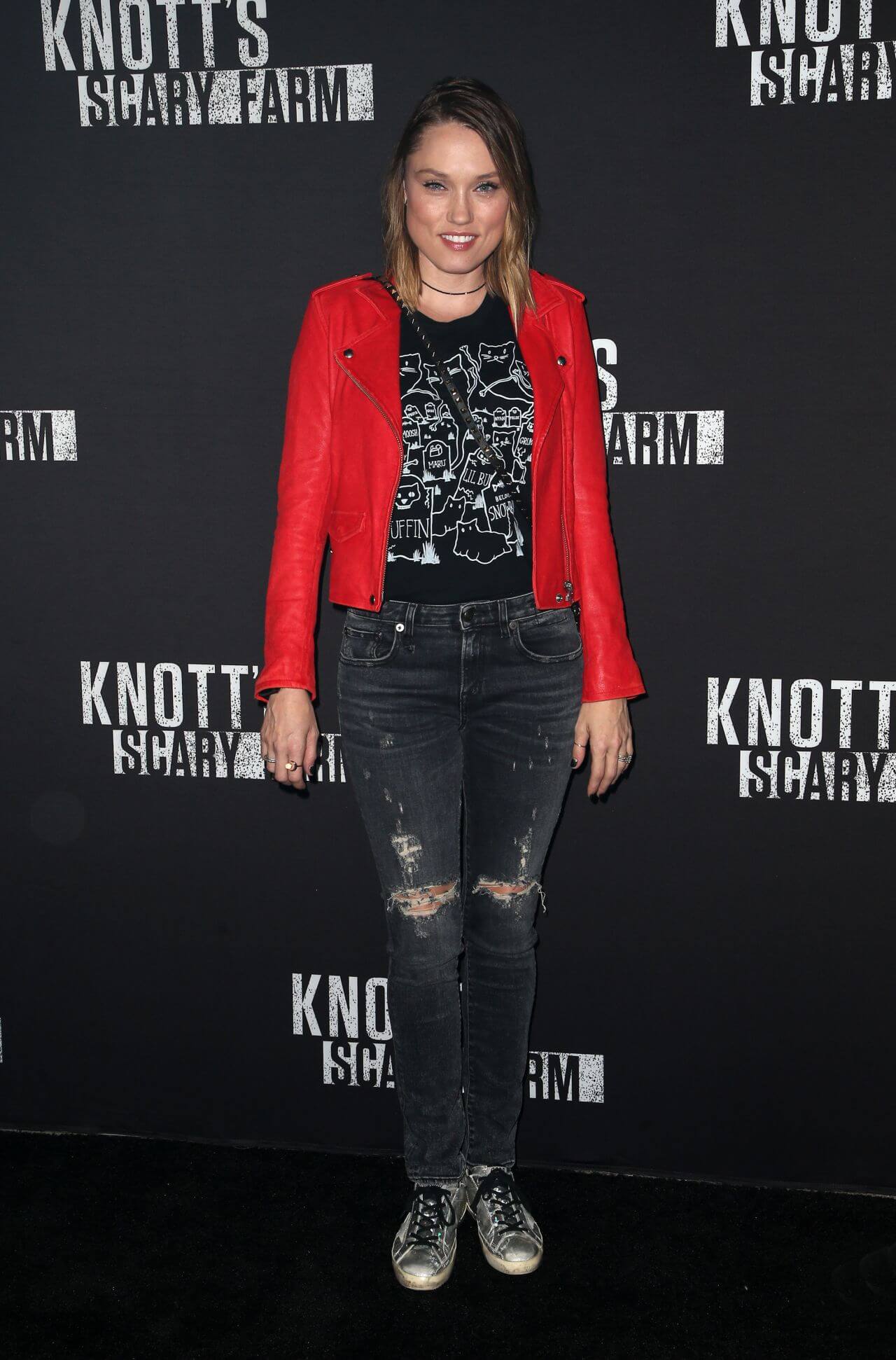 Clare Grant  In Red Leather Jacket Under a Black T-shirt With Ripped Jeans At Knott’s Scary Farm Celebrity Night in Buena Park