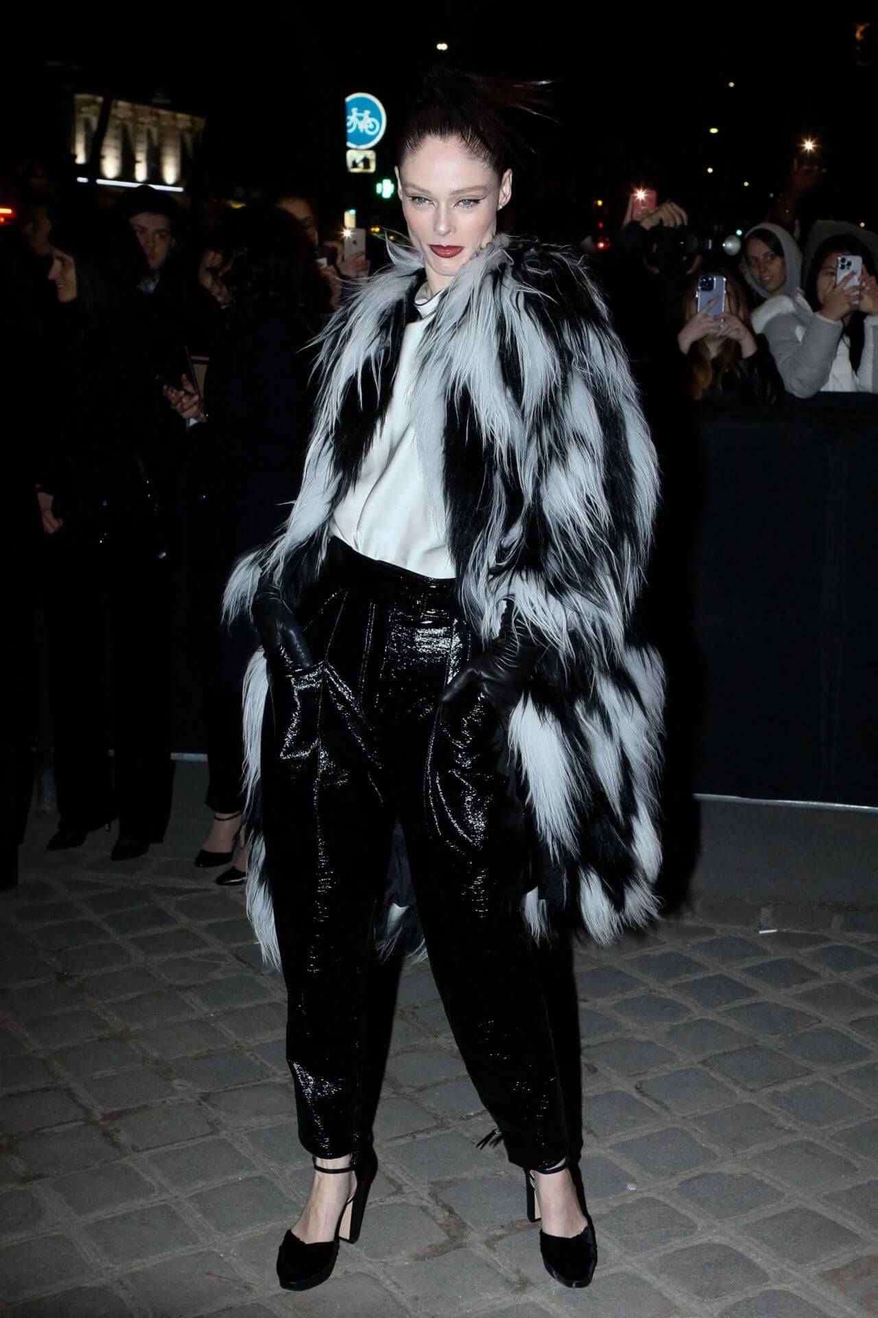 Coco Rocha In White Shirt and Shiny black Pants With Fur Coat 