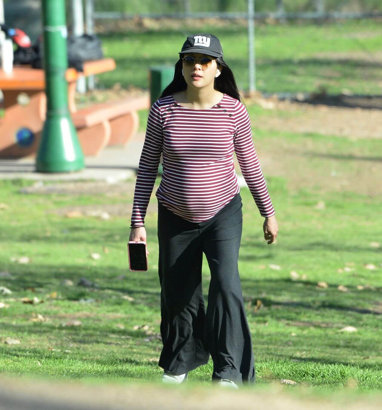 Constance Wu In Red Striped Full Sleeves Top With Black Flare Pants At Park in Los Angeles