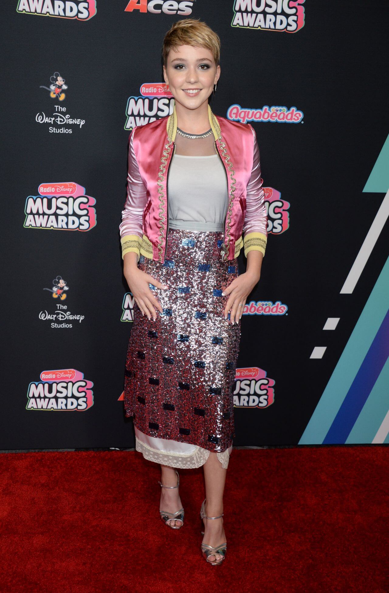 Cozi Zuehlsdorff  In Pink Shimmery Coat With Gown Dress At Radio Disney Music Awards in LA