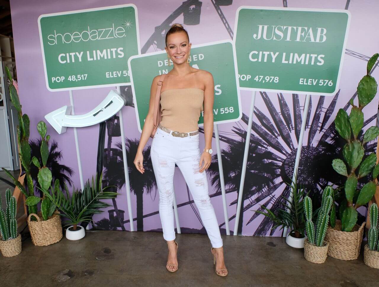 Caitlin O’Connor  In a Beige Strapless Top With  Ripped Jeans At JustFab and Shoedazzle Present The Desert Oasis LA
