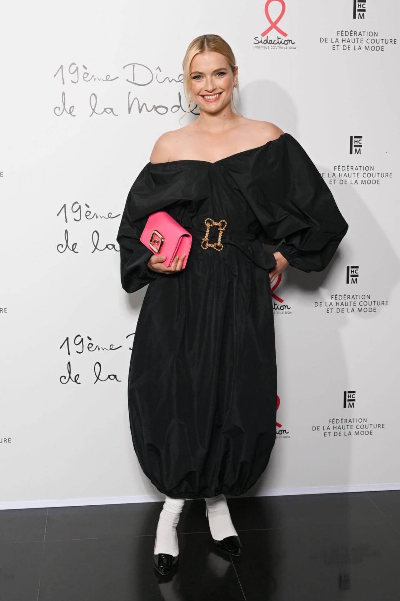 Camille Razat  In Black Off Shoulder Baggy Outfit At “Diner De La Mode” Pavillon Cambon Capucines in Paris