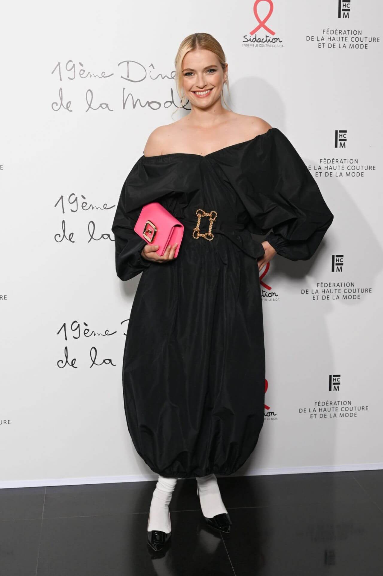 Camille Razat In Black Off Shoulder Baggy Outfit At “Diner De La Mode” Pavillon Cambon Capucines in Paris
