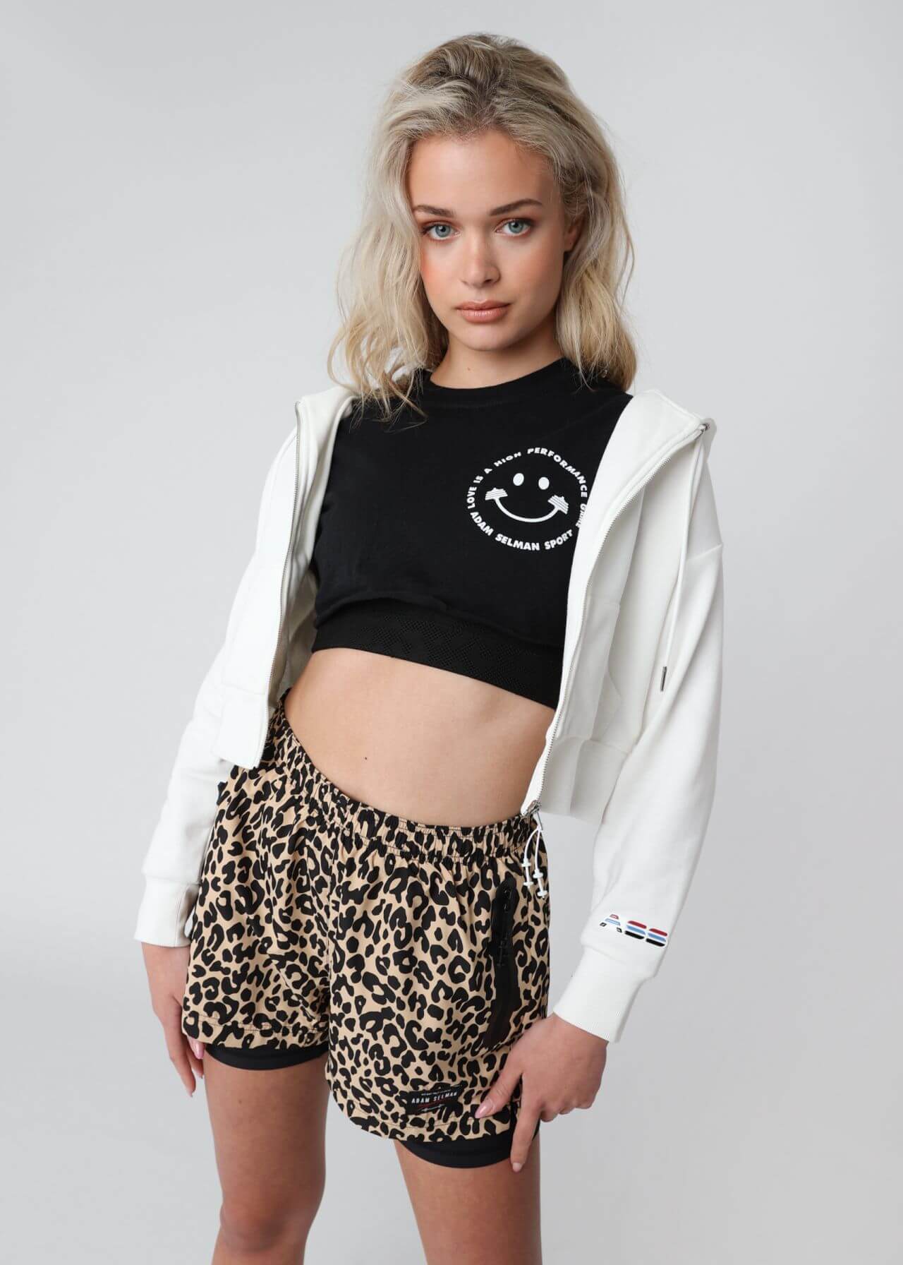 Carolina V. Marie Cool Looks In White Jacket With Black Crop Top & Tiger Print Shorts Pants