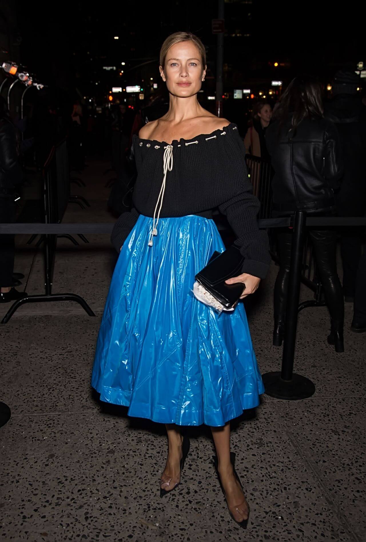 Carolyn Murphy In Black Off Shoulder Top With Blue pleated Flare Skirt At  Calvin Klein Show FW18, NYFW
