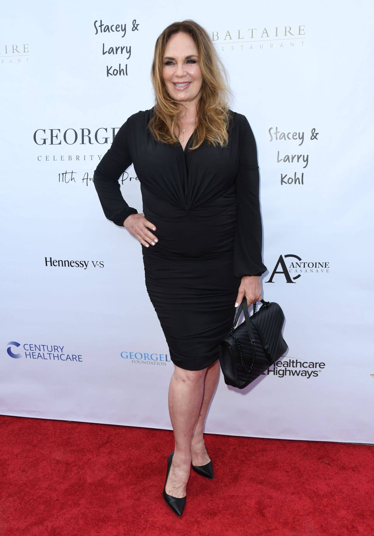 Catherine Bach  In Black Pleated Full Sleeves Short Dress At George Lopez Golf Classic Pre-Party in Brentwood