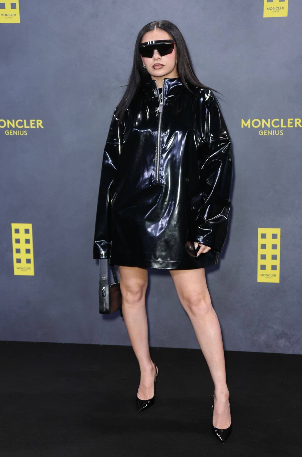 Charli XCX In Shiny Black Leather Outfit At Moncler Presents: The Art of Genius in London