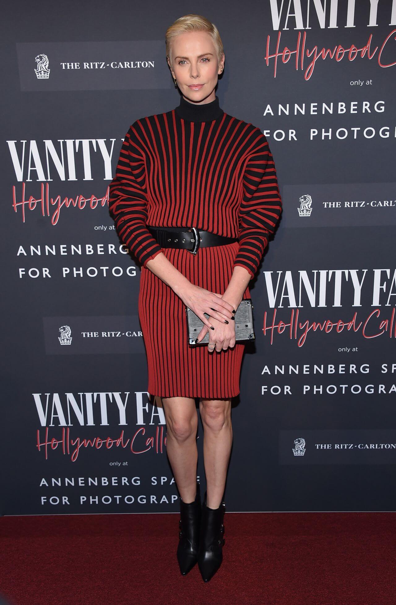 Charlize Theron  In Red Striped Full Sleeves Short Dress At“Vanity Fair: Hollywood Calling” Exhibition LA