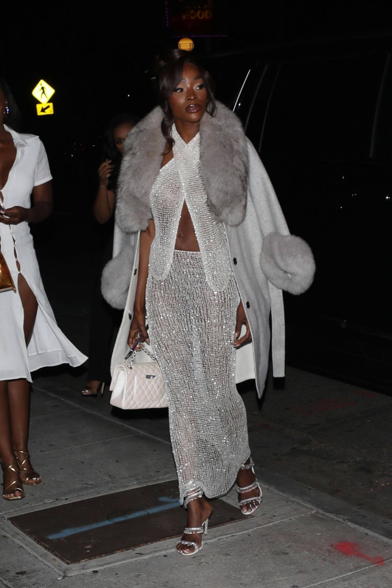Chelsea Lazkani  In White Fur Overcoat With Shimmery Crochet Outfit At Delilah Restaurant in West Hollywood