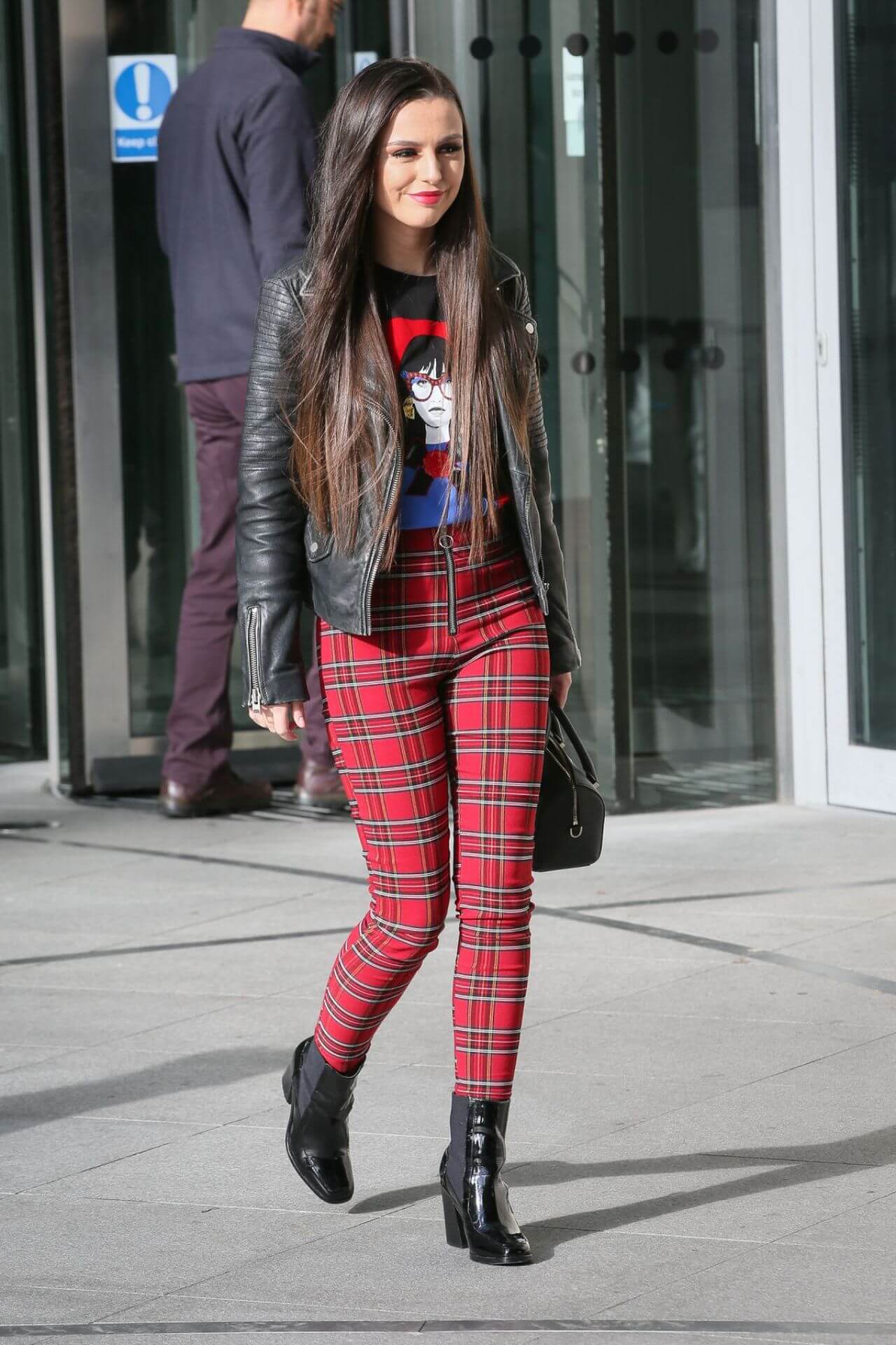 Cher Lloyd Gorgeous Looks In Black Leather Jacket Under T-shirt With Red Checked Pants Outfits