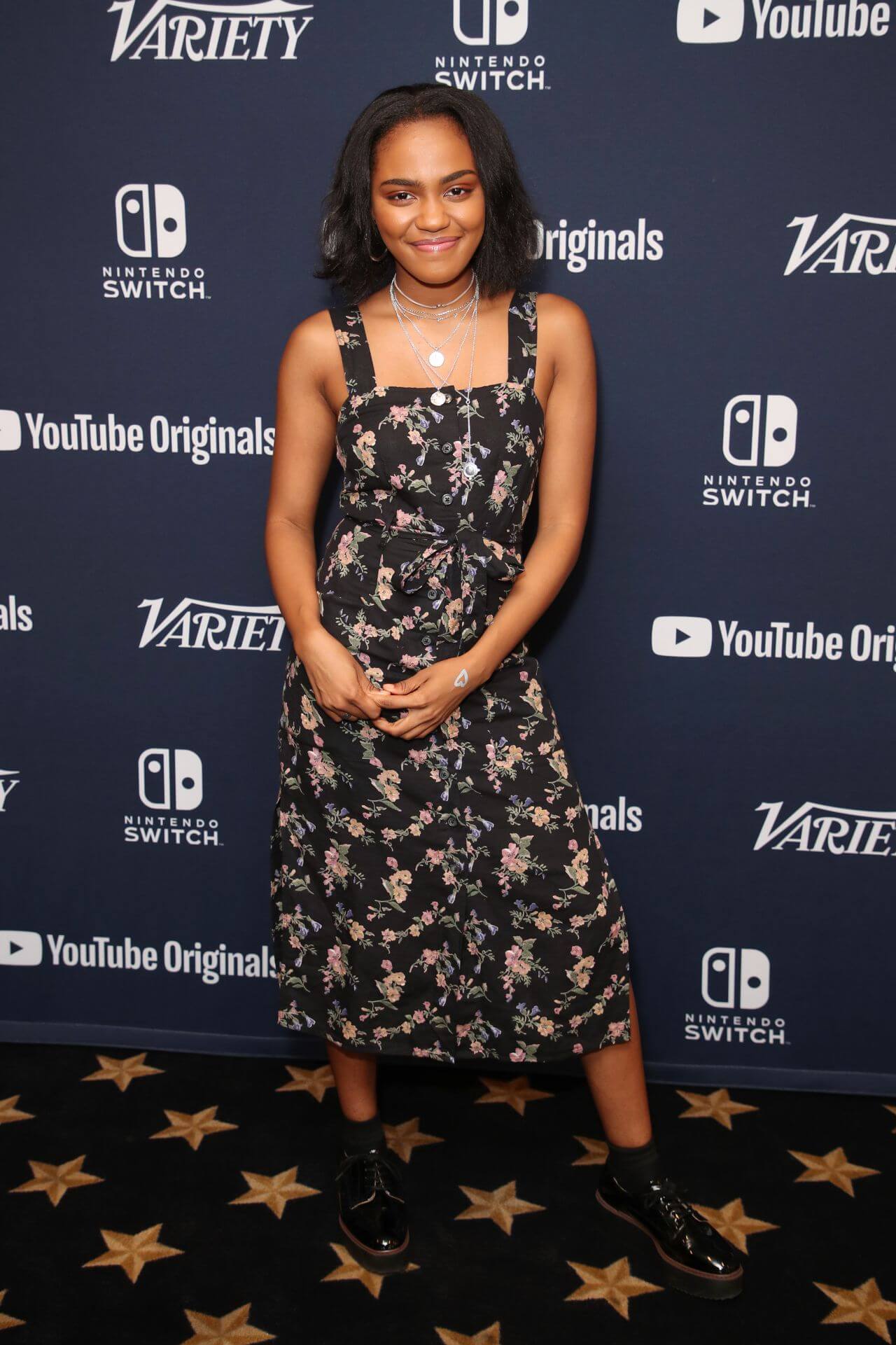 China Anne McClain In Black Floral Print Strap Sleeves Long Dress At Variety Studio SDCC