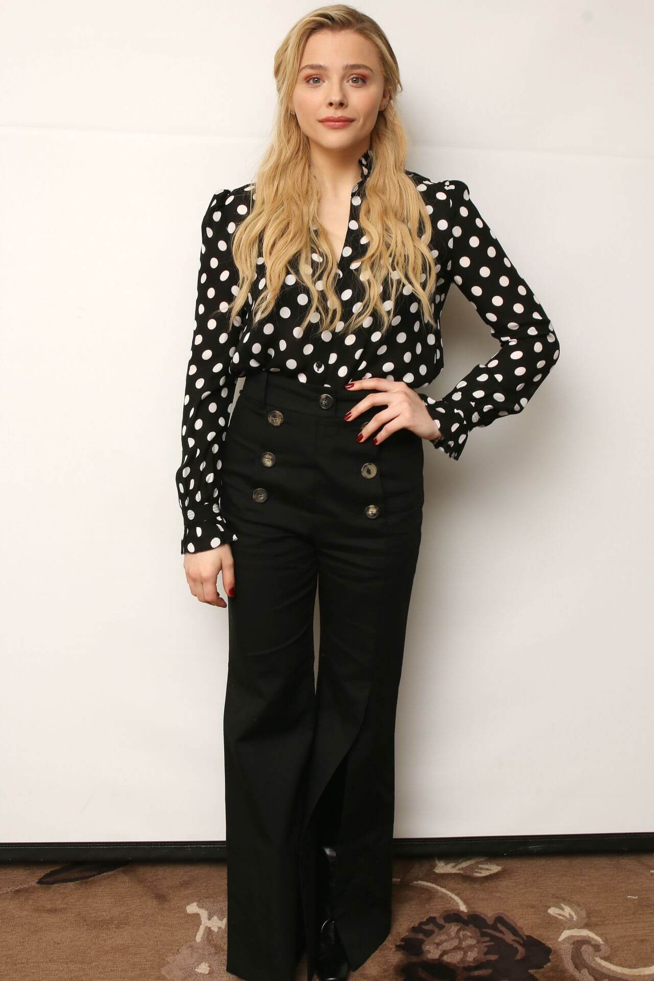 Chloe Moretz  In Polka Dot Full Sleeves Top With Black Bottoms At“Greta” Press Conference in LA