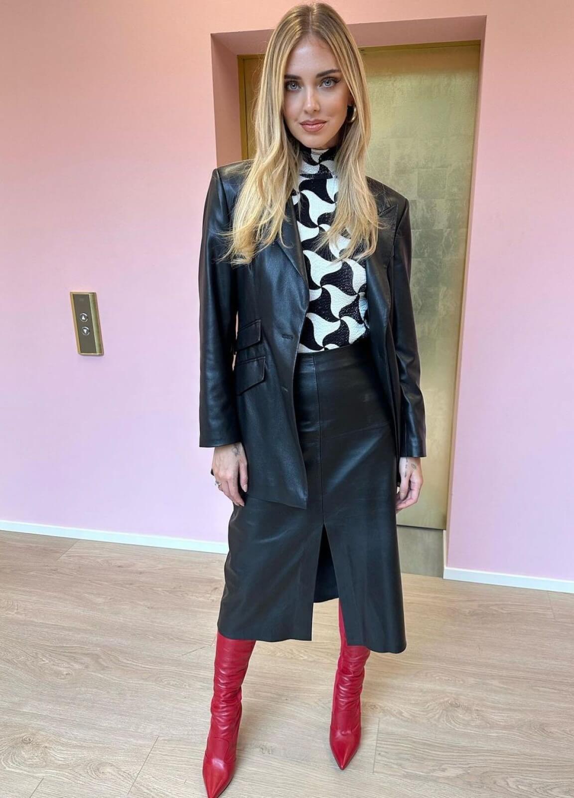Chiara Ferragni In Black Leather Long Jacket Under High Neck Top With Long Slit Cut Skirt Outfits