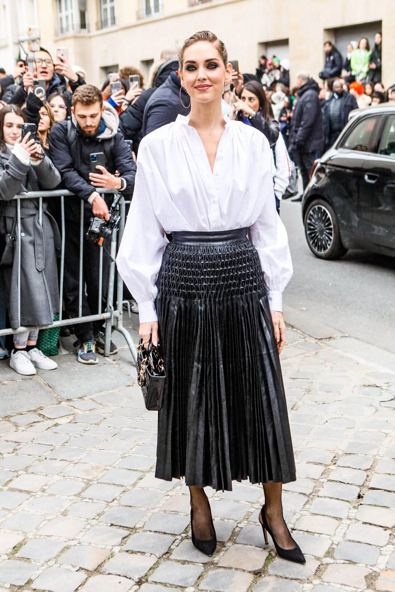 Chiara Ferragni  In a White Baggy Shirt With Pleated Long Leather Skirt Outfit