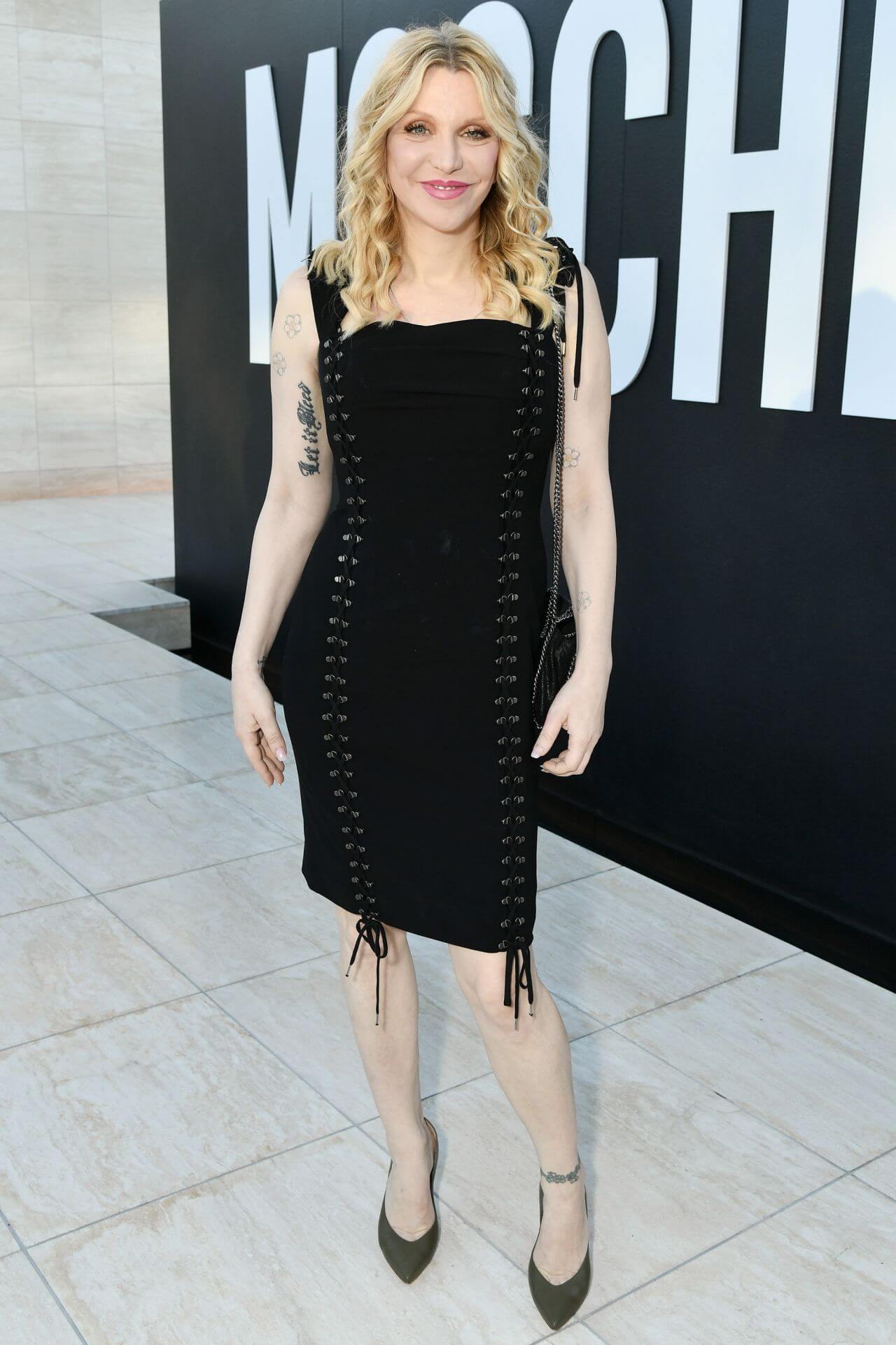 Courtney Love In Black Bodycon Dress At MOSCHINO Spring Summer Collection in LA