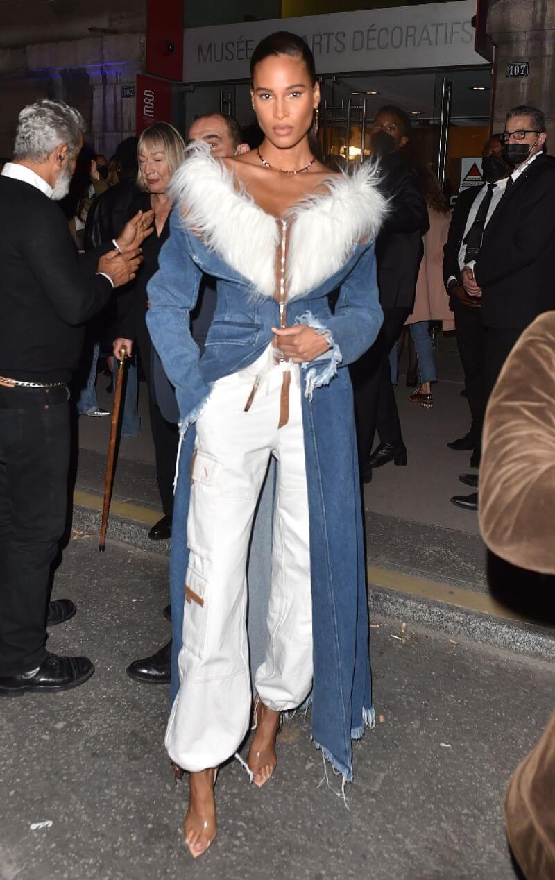 Cindy Bruna  In Denim With Fur Style  Overlong Jacket With White Joggers At “Thierry Mugler: Couturissime” Photocall in Paris