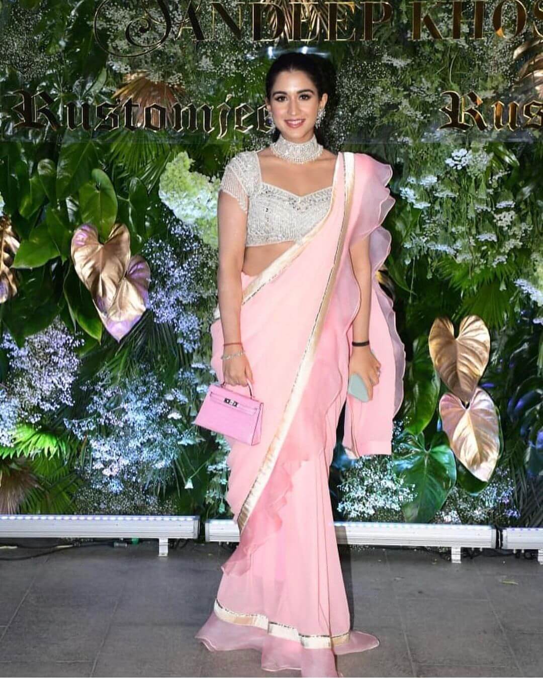 Radhika Merchant In Light Pink Ruffle Saree With Her Mini Bag