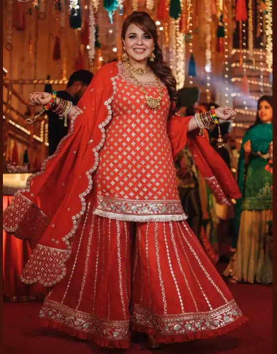 Fabulous Ginni Chatrath In Orange Sequence Embroidery Sharara Set