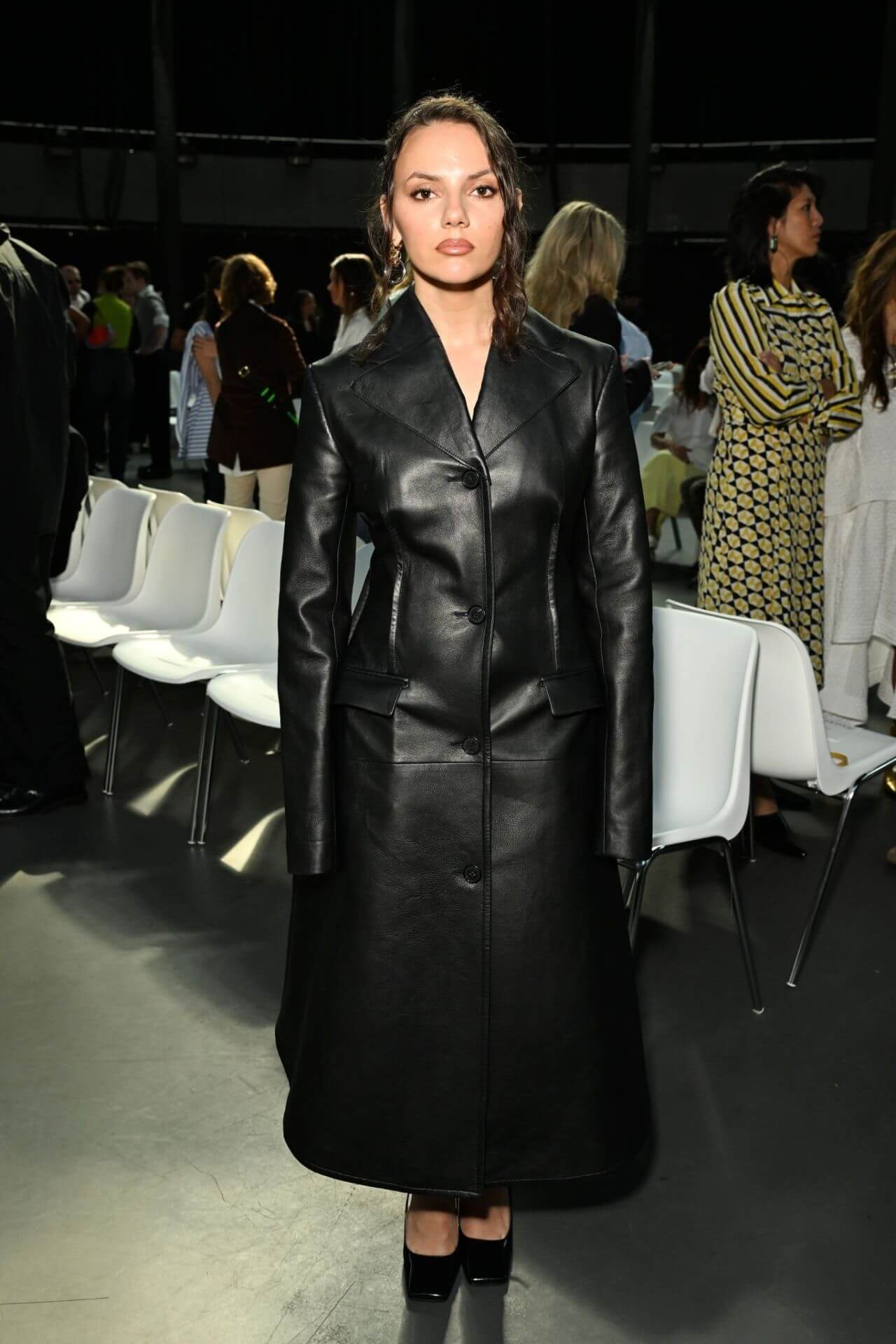 Dafne Keen In Black Long Leather Coat at London Fashion Week
