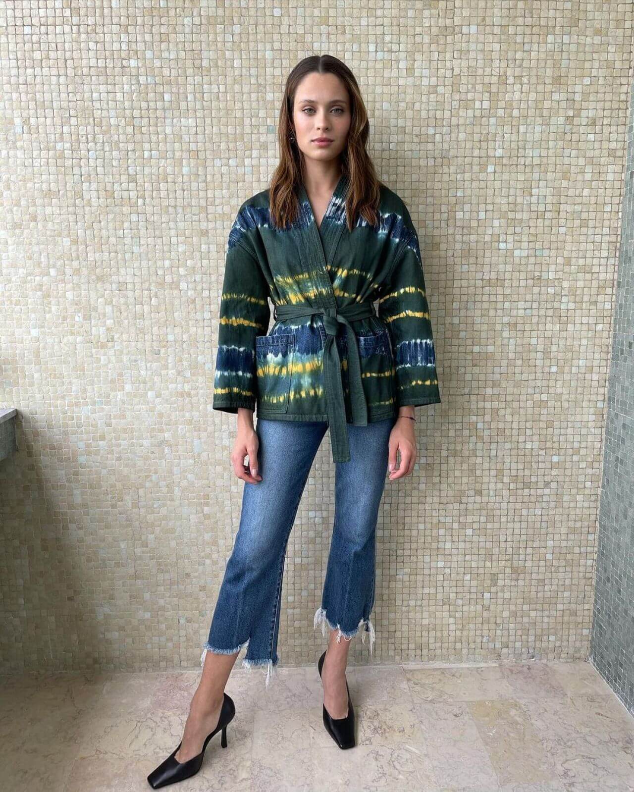Daniela Melchior  In Green Printed Wrapped Jacket With Denim Jeans