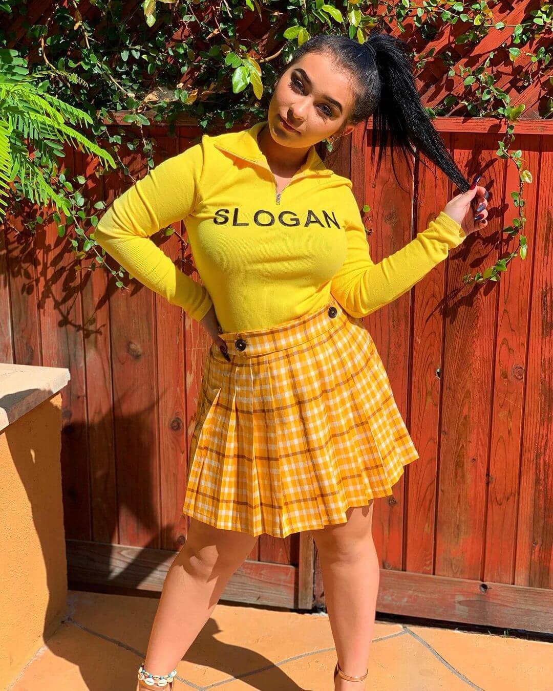 Danielle Cohn In Yellow Collar T-shirt With Checked Short Skirt