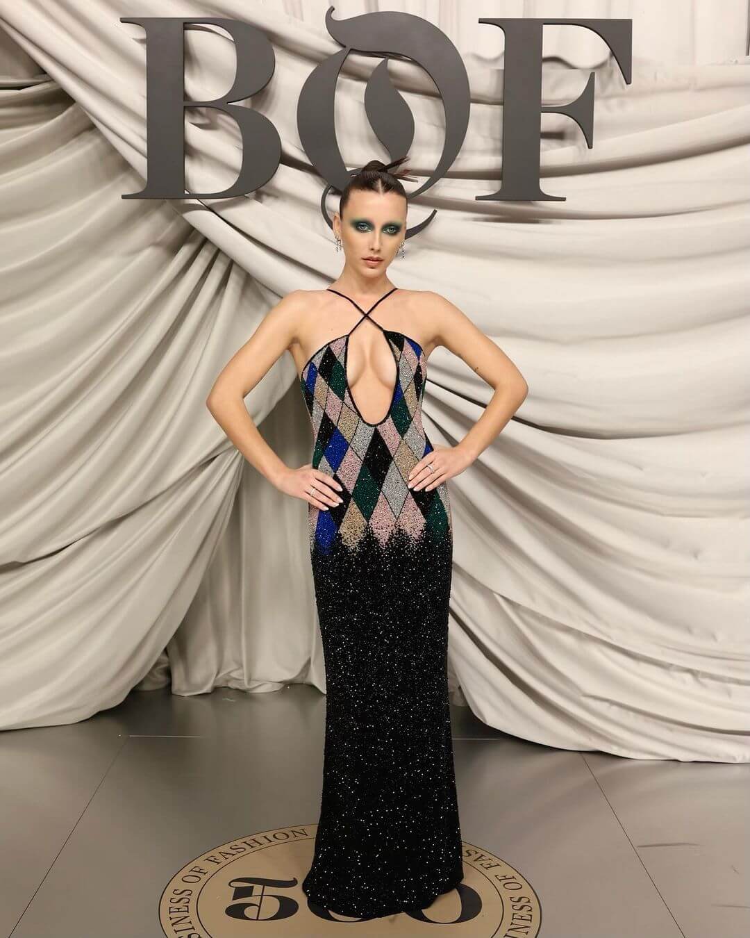 Emma Chamberlain In a Black Multi shimmery Cut Out Long Dress