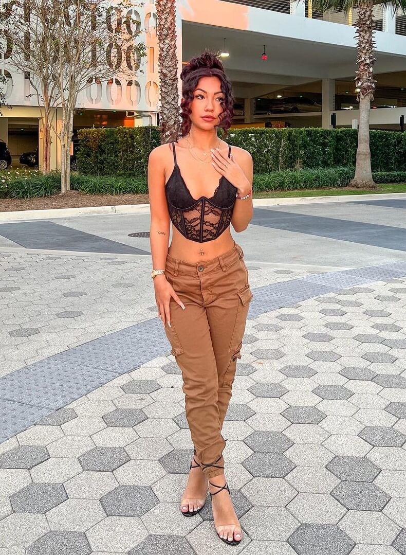 Jazlyn G In a Black Bralette Top With Cargo Pants