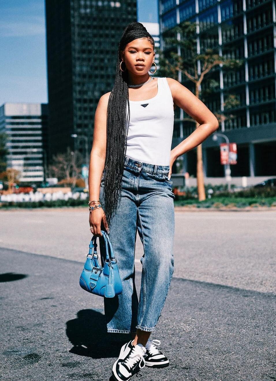 Storm Reid In White Sleeveless Top With Denim Bottoms