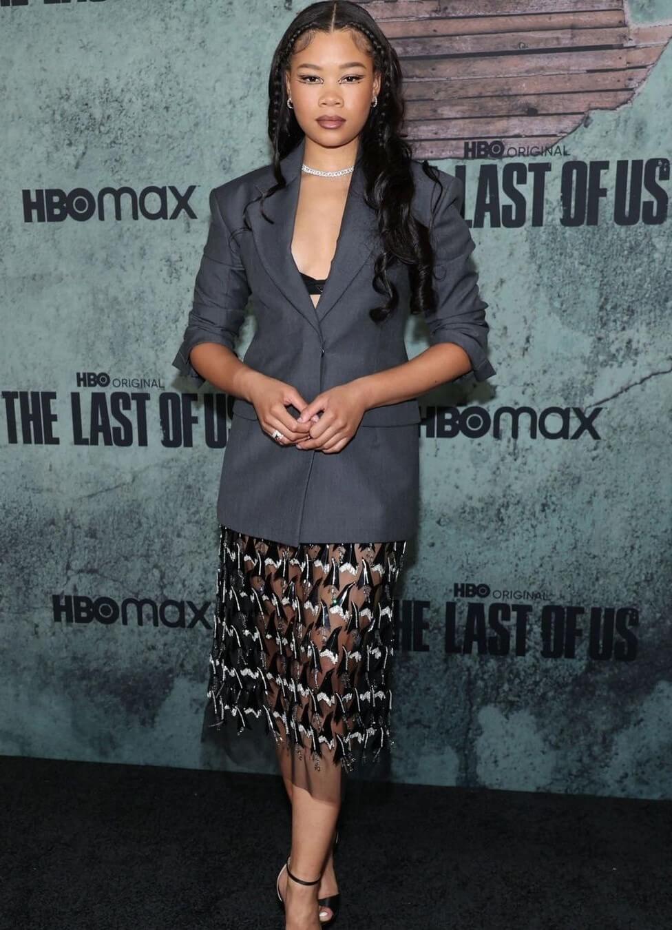 Storm Reid In a Black Shimmery Long Dress With a Grey Blazer