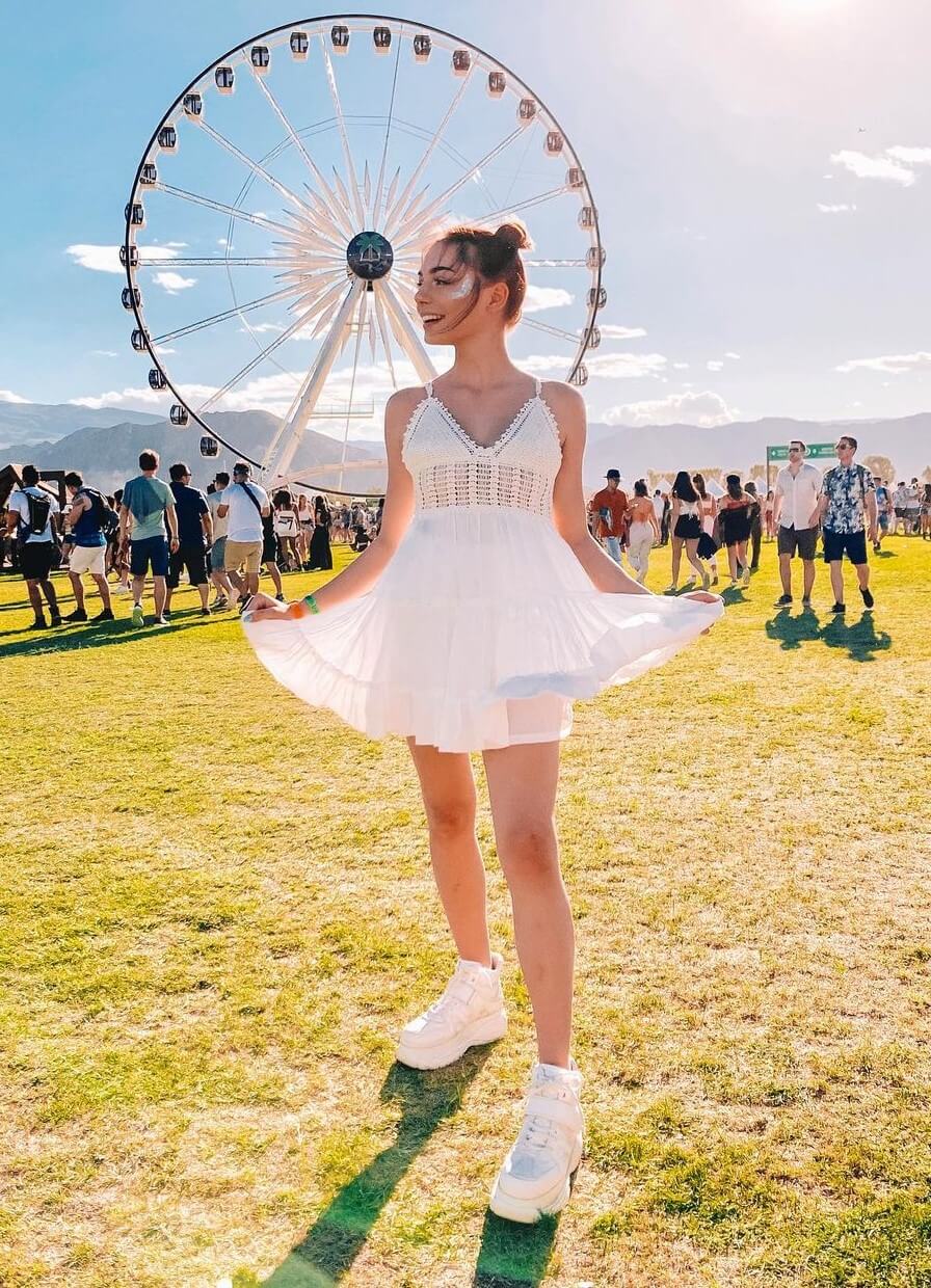 Tina Neumann In White Flare Mini Outfit