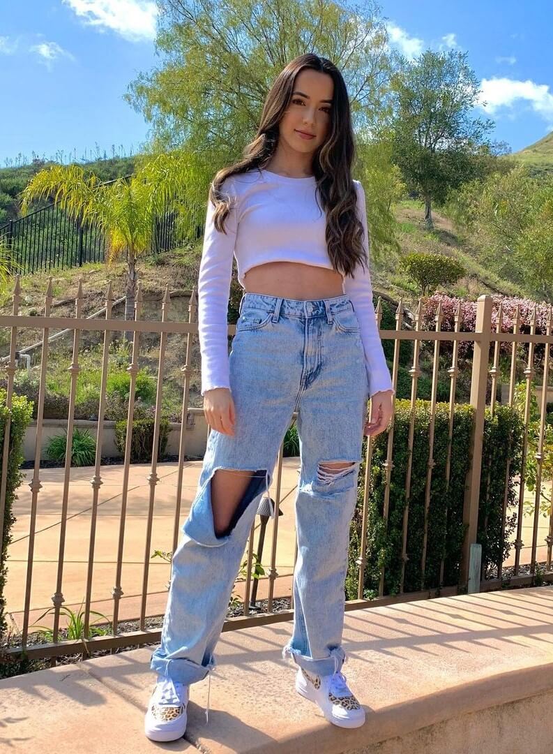 Veronica Merrell In White Full Sleeves Crop Top With Ripped Jeans
